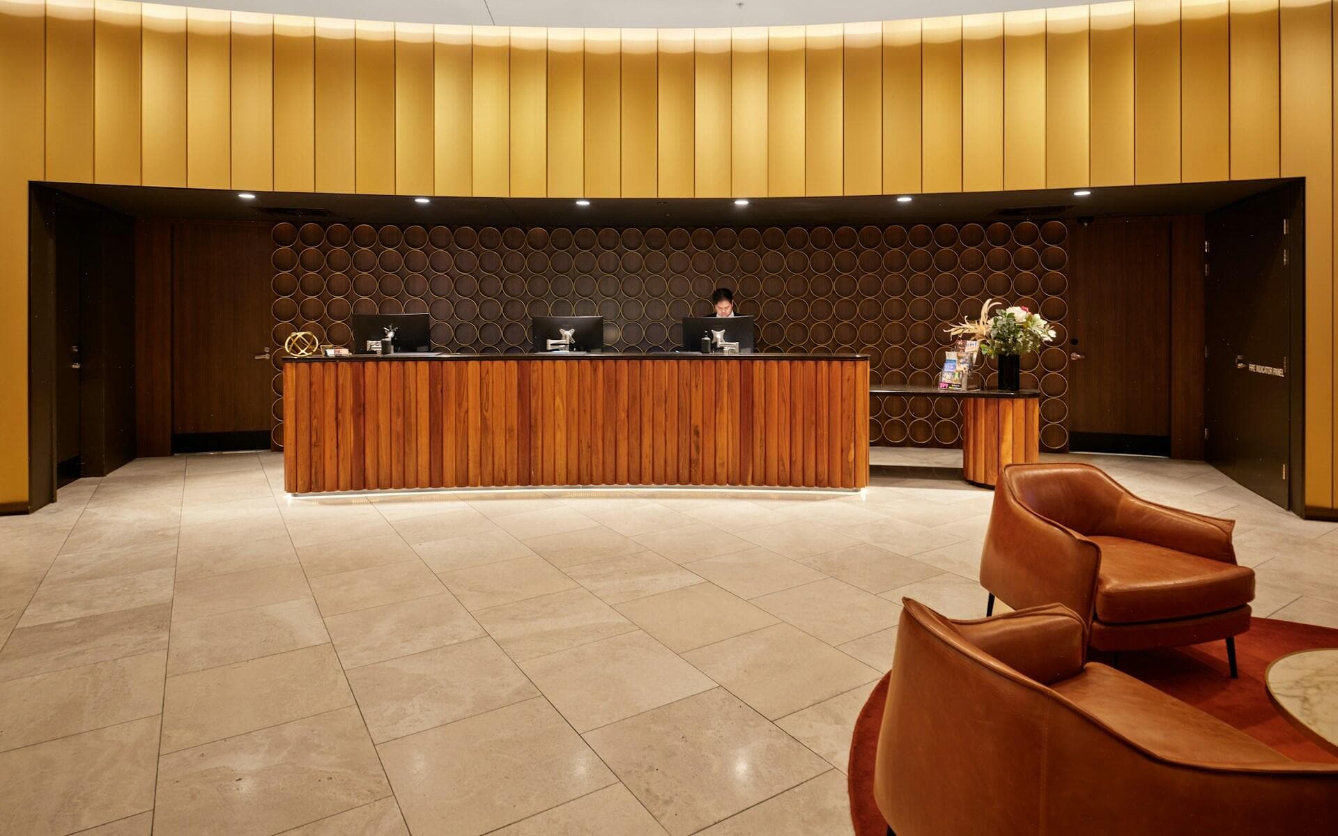 A reception desk in a hotel lobby