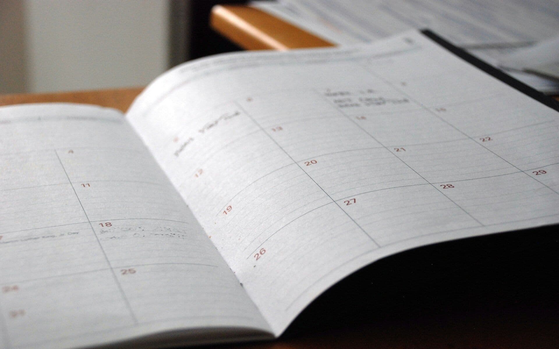 An open planner on a desk